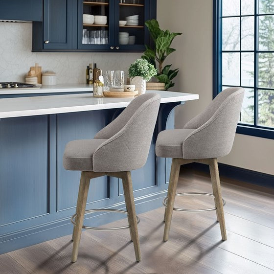 Upholstered swivel stools with solid wood legs and metal footrests.