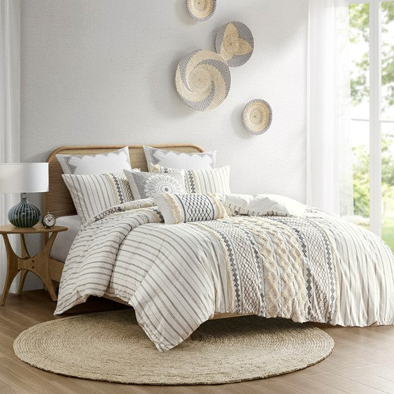 Bring a soft, mid-century look to your bedroom with the INK+IVY Imani Cotton Comforter Mini Set. The cotton comforter features geometric prints with tufted chenille that adds dimension and charm to the bedding set. Hidden bartacks give the comforter a duvet-like finish, while the solid reverse complements the eye-catching patterns seen on top of the bed. Two cotton shams reiterate the designs of the comforter, creating a stunning coordinated look. Made from 100% cotton, this comforter mini set is machine washable and offers a refreshingly soft update to your bedroom decor. This bedding set is also OEKO-TEX certified, meaning it does not contain any harmful substances or chemicals, ensuring quality comfort and wellness.